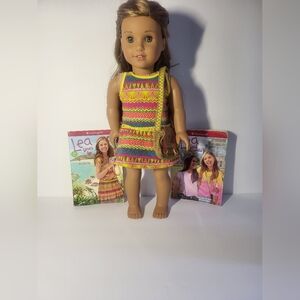 Lea American Girl doll with 2 Leah books. 4 American girl doll dresses